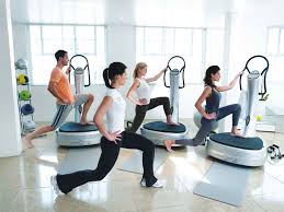 Three women working out on Power Plate Vibration Plate machines